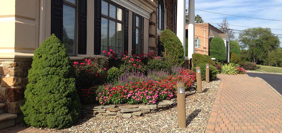 We installed rock ground cover at this commercial property in Watchung, NJ.