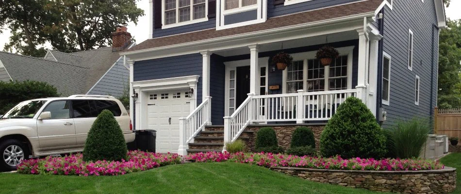 Trimmed plants in front of a house in Westfield, NJ.